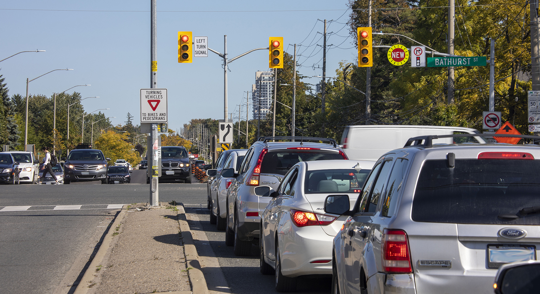 busy intersection with many cars stopped at the red signal